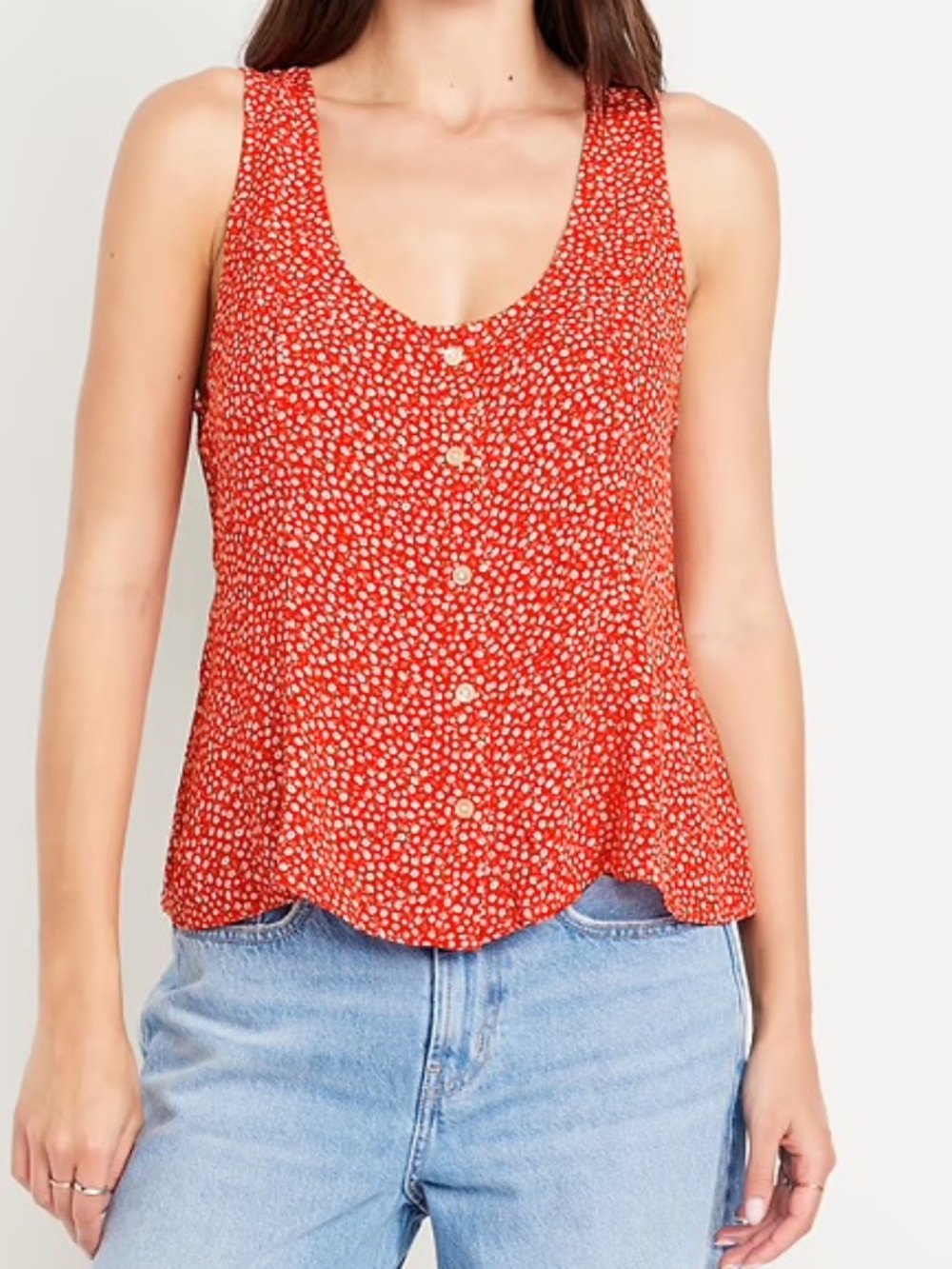 Peplum style slightly cropped tank, functional buttons